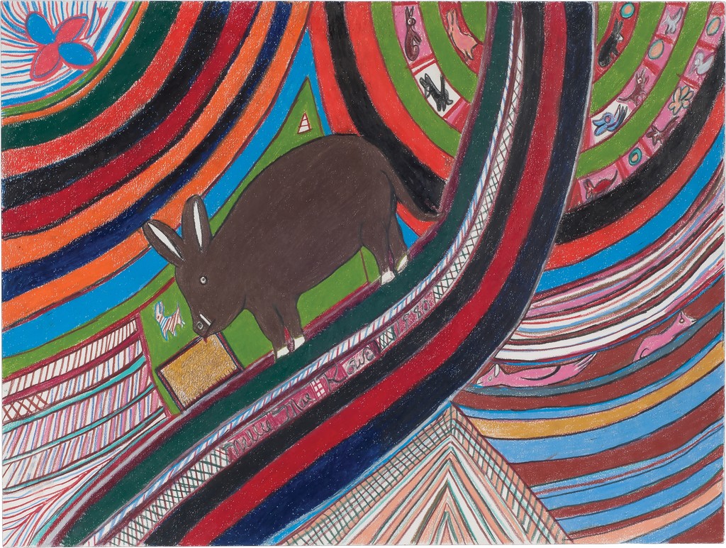 A brown pig stands among a maze of multicolored stripes, some of which have animals drawn within them. 