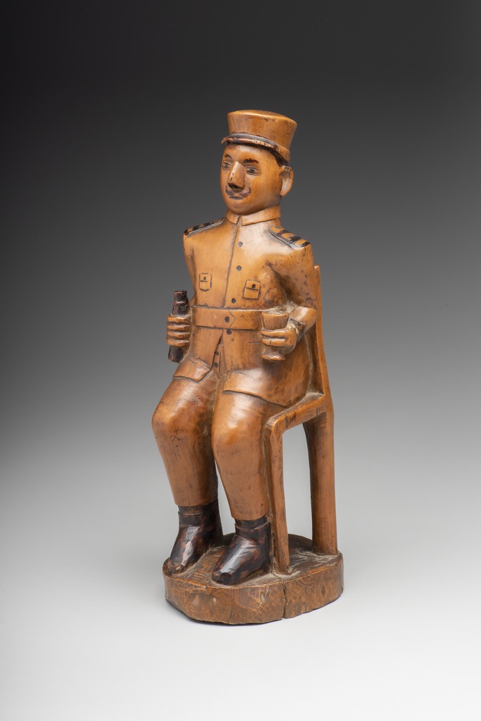 Seated Colonial Figure