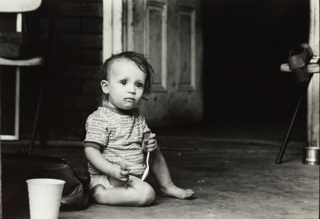 Cabbagetown [Baby on porch with two spoons in his hands]