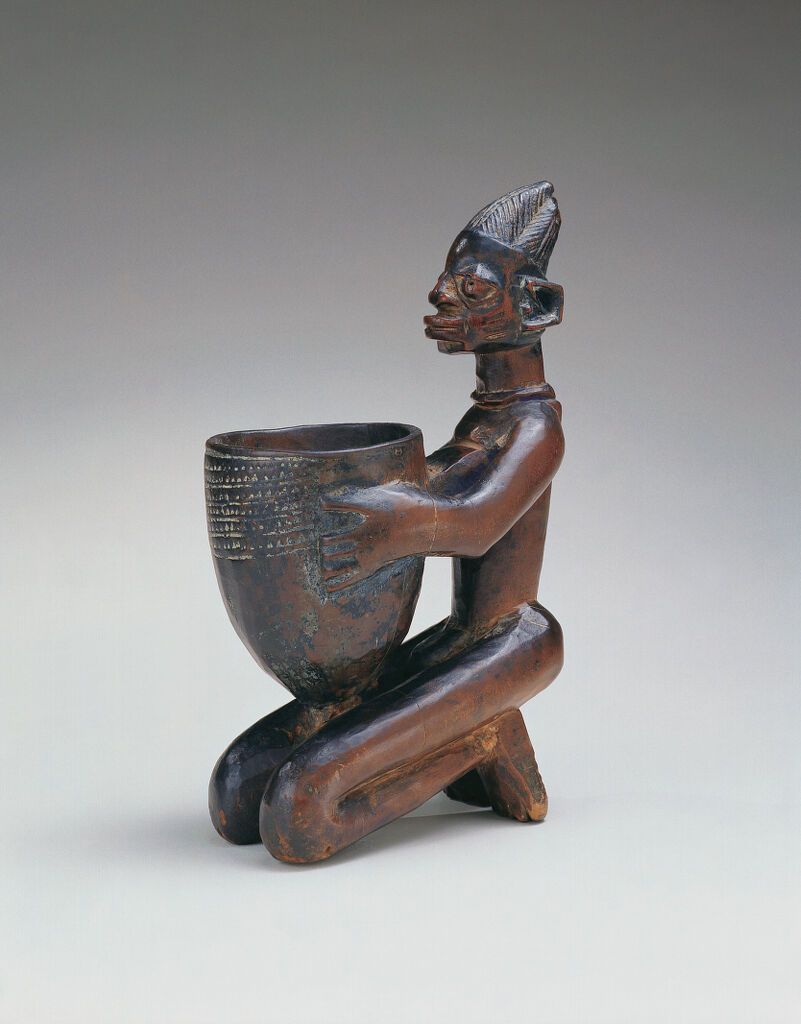 Kneeling Figure with Bowl