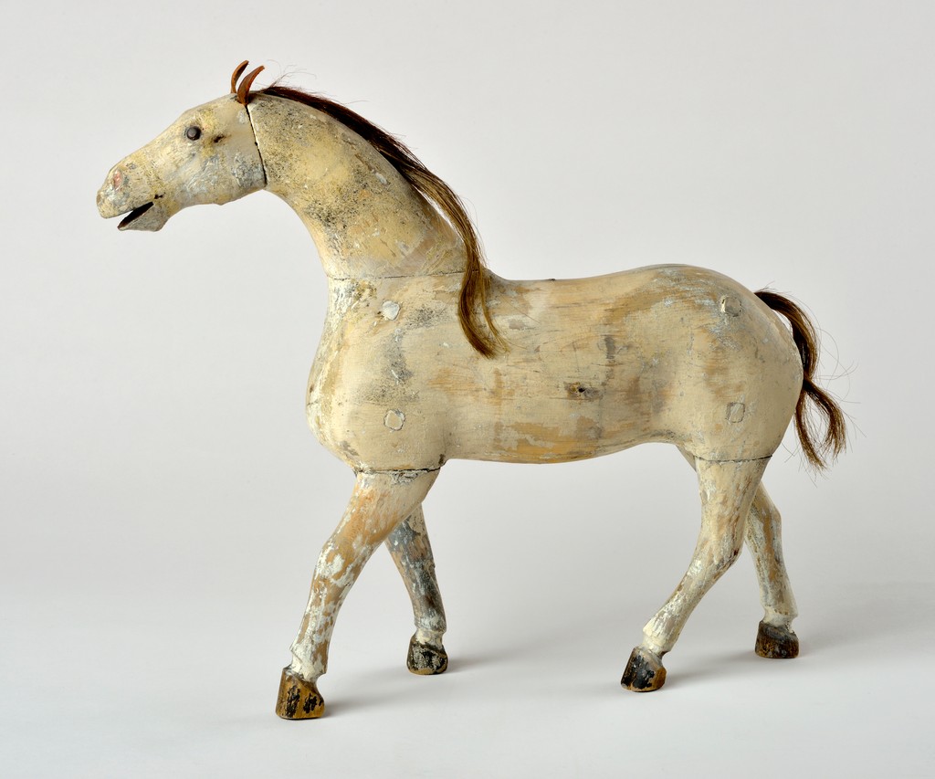 American carved wooden white horse having horsehair mane and tail, leather ears and nail-head eyes