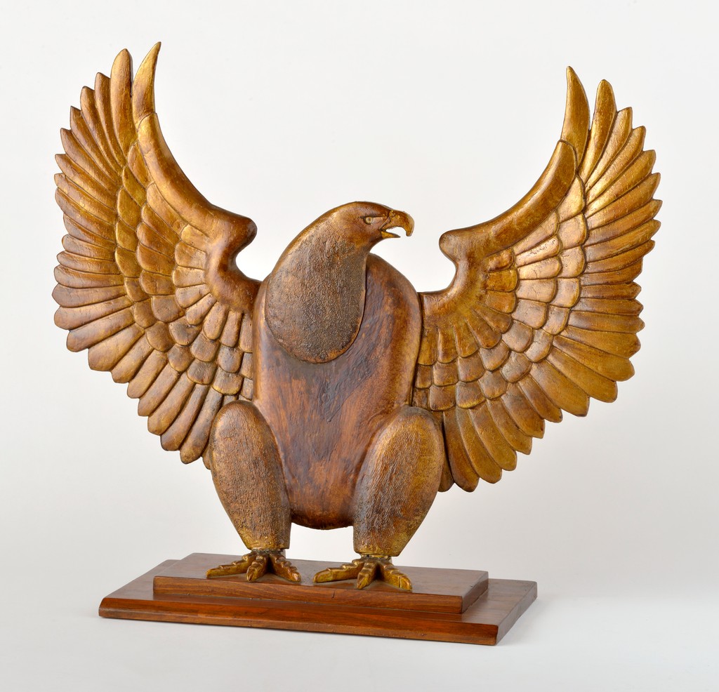 American carved wooden gilded eagle with outstretched wings on stepped rectangular stand