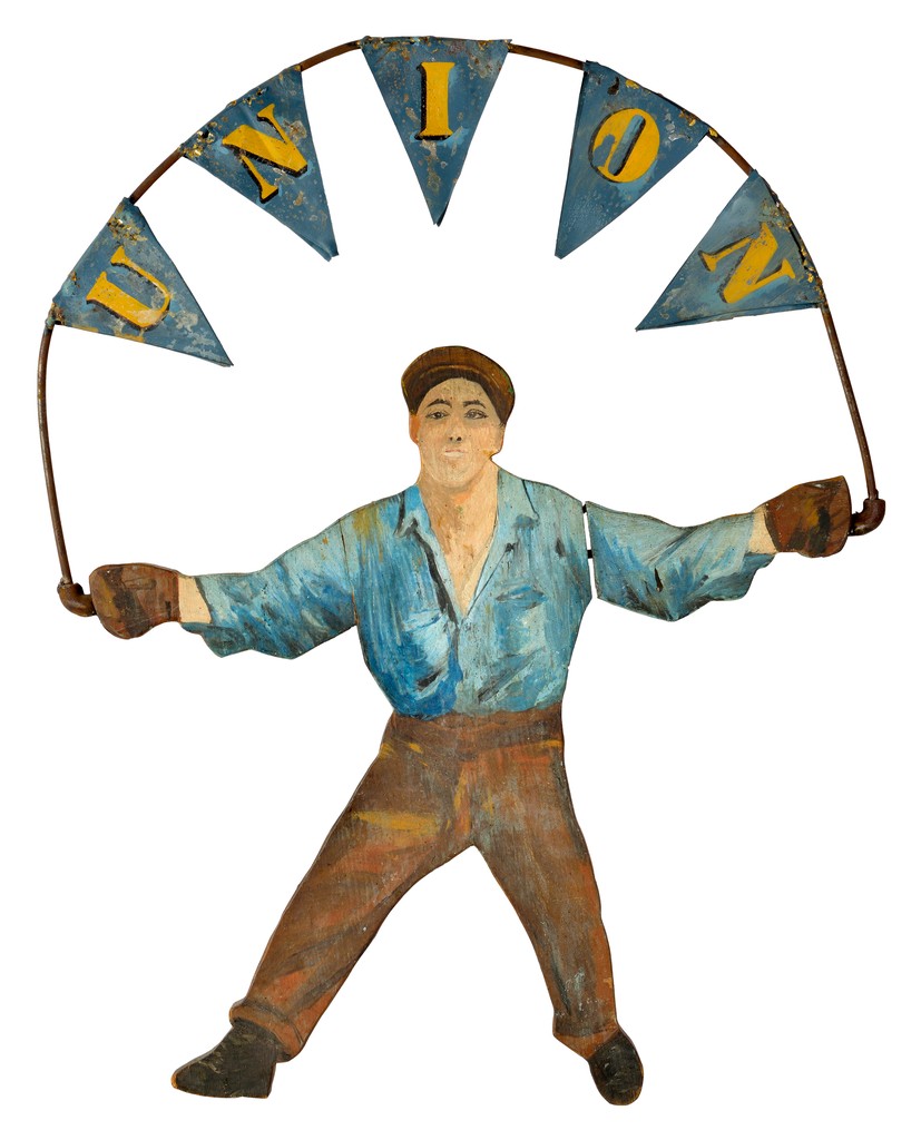 American polychrome carved wooden sign depicting standing man holding metal pennants on metal frame spelling out UNION for use at union meetings