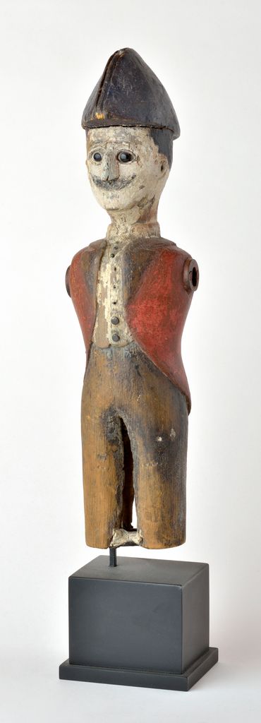 American full-figure carved wooden sculpture depicting standing