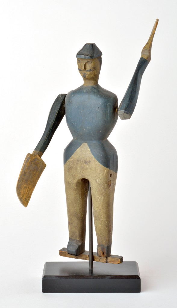 Continental polychrome carved wooden figural soldier whirligig on metal base, left foot missing