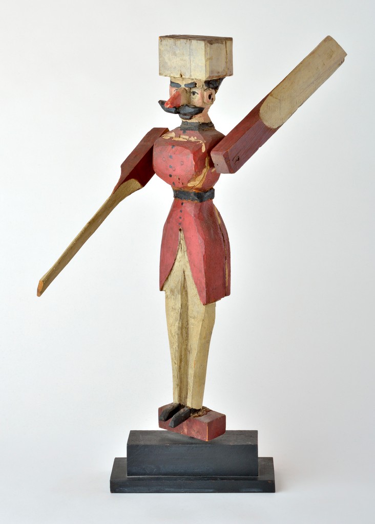 American polychrome carved wooden figural whirligig in the form of a Russian soldier, repainted condition on metal stand; puported to have been made by a Russian immigrant in New Jersey