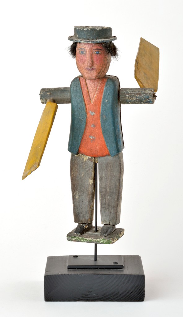 American polychrome carved wooden figural hobo whirligig wearing with metal hat on wooden base on wooden stand, lacking hands