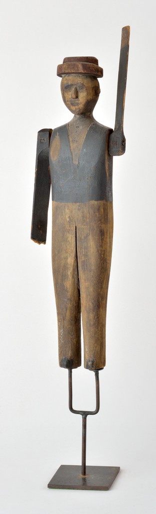 American polychrome carved wooden figural man whirligig on u-shaped metal base