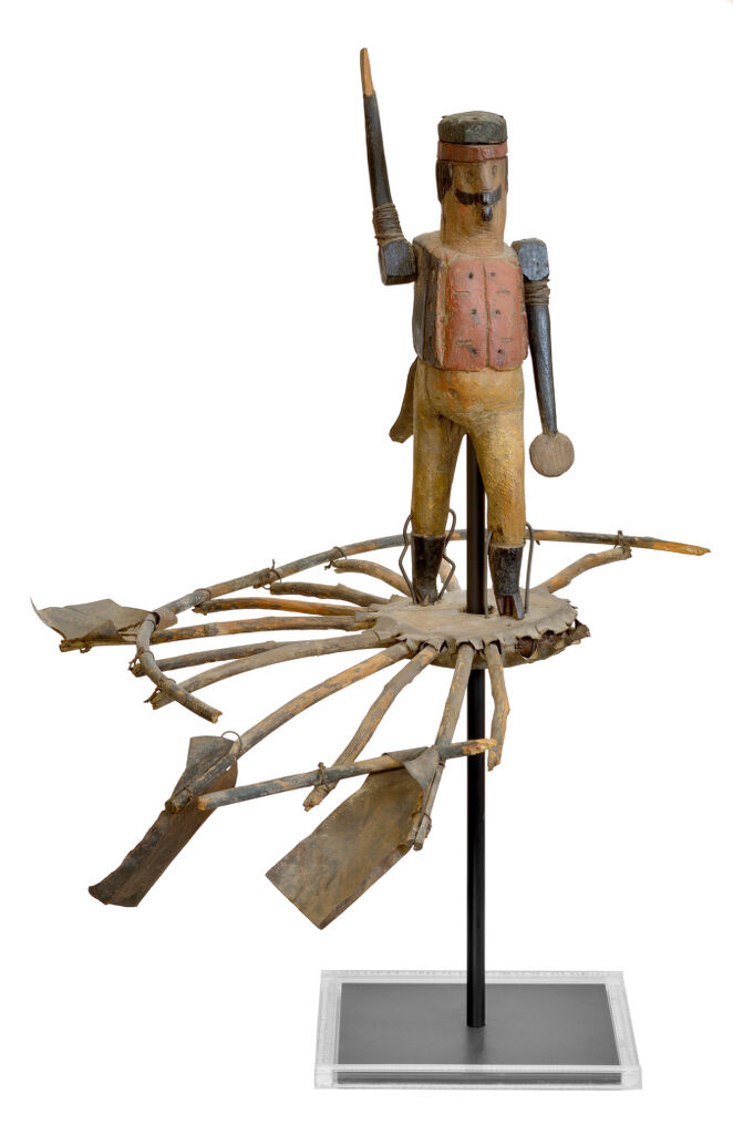 American polychrome carved wooden figural soldier whirligig with paddle arms on circular twig wheel with tin platform and blades that turn